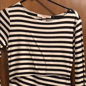 Long sleeve striped dress with diagonal folds.
